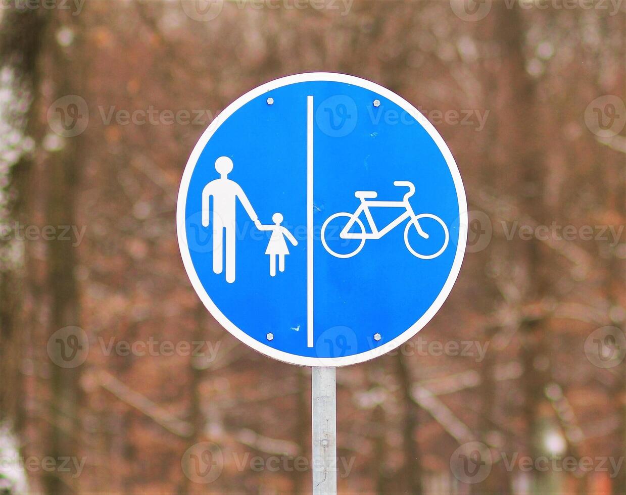Traffic sign for pedestrian and bicycle only against the background of a park photo