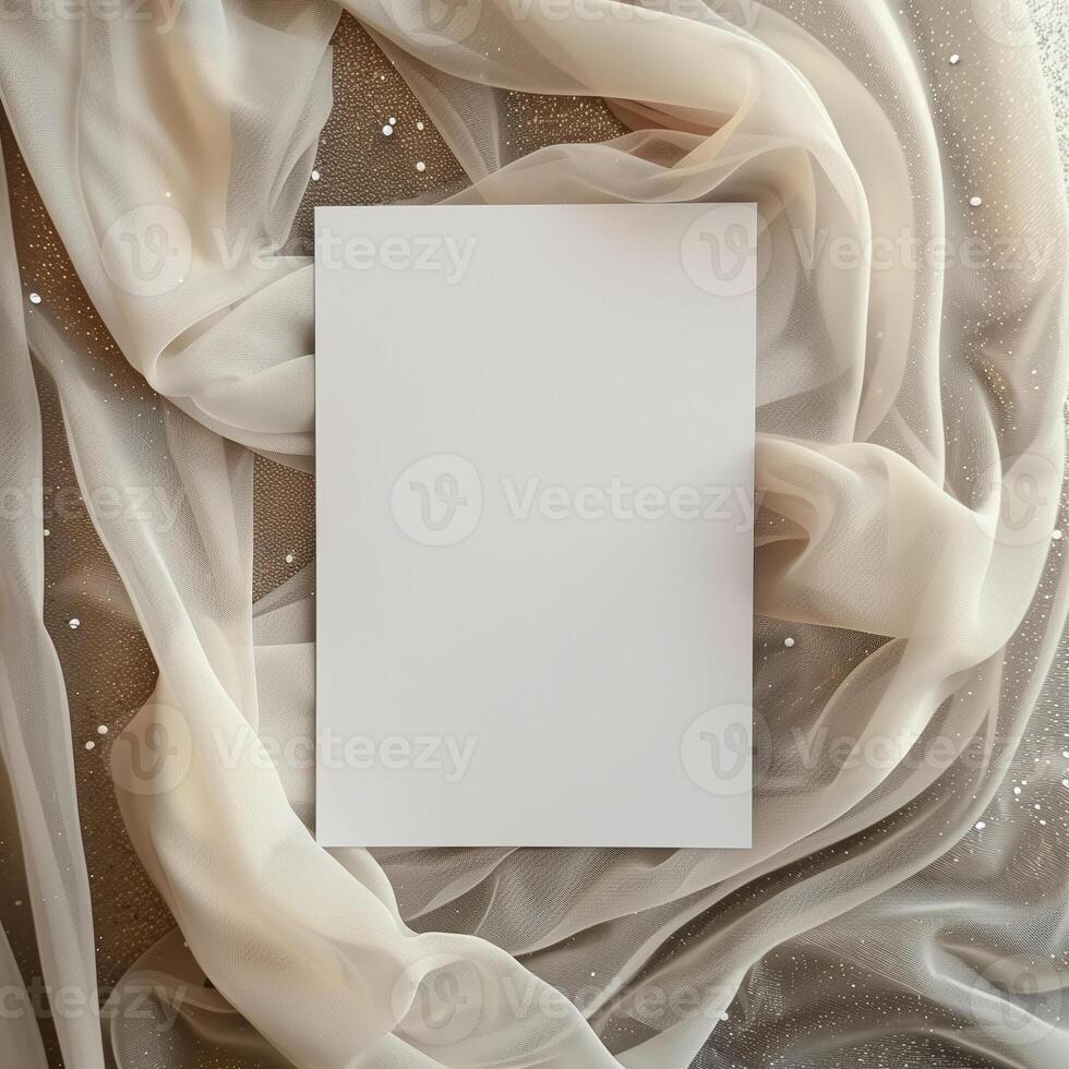 Blank paper card mockup on beige fabric with glitter. photo