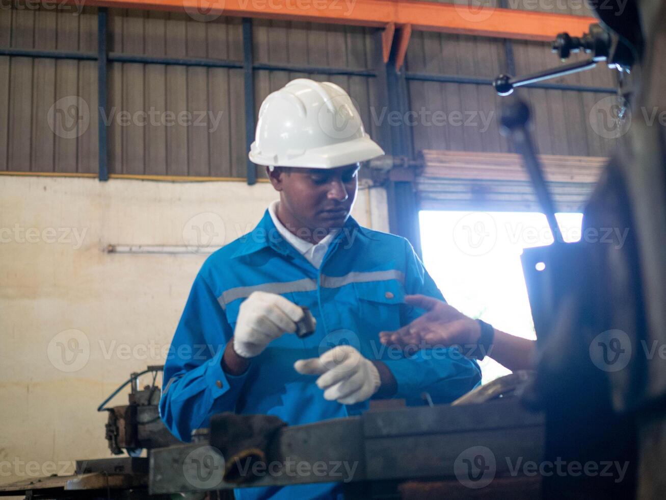 White hardhat helmet safety uniform factory work job occupation maintenance engineer industry construction foreman architect builder professional pointing finger cheerful look construction project photo