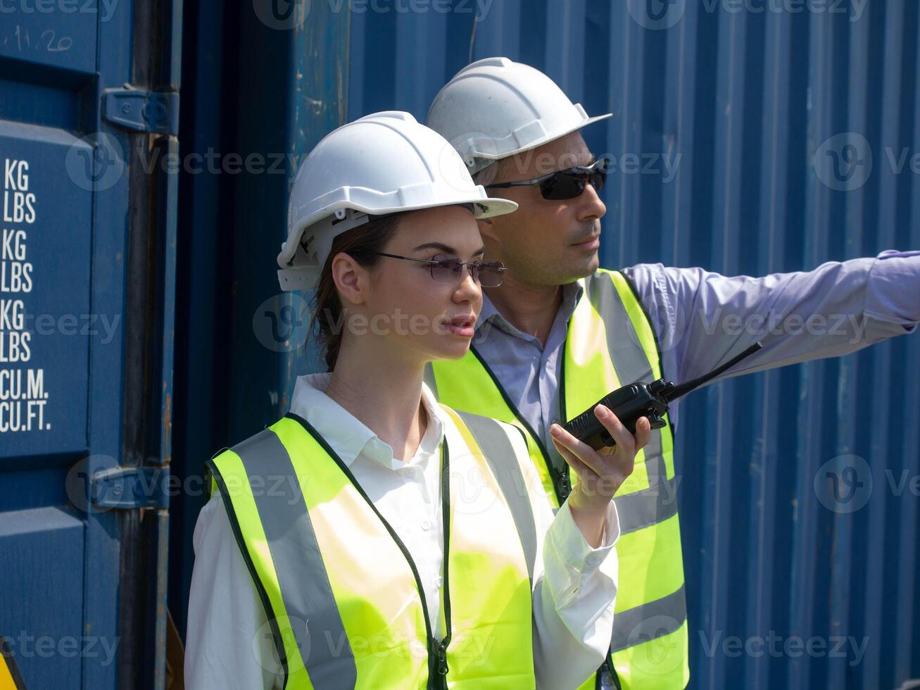 Labor supervisor manage white hardhat helmet safety talkie walkie radio speak discussion teamwork group occupation factory container cargo logistic communication explain warehouse import export custom photo
