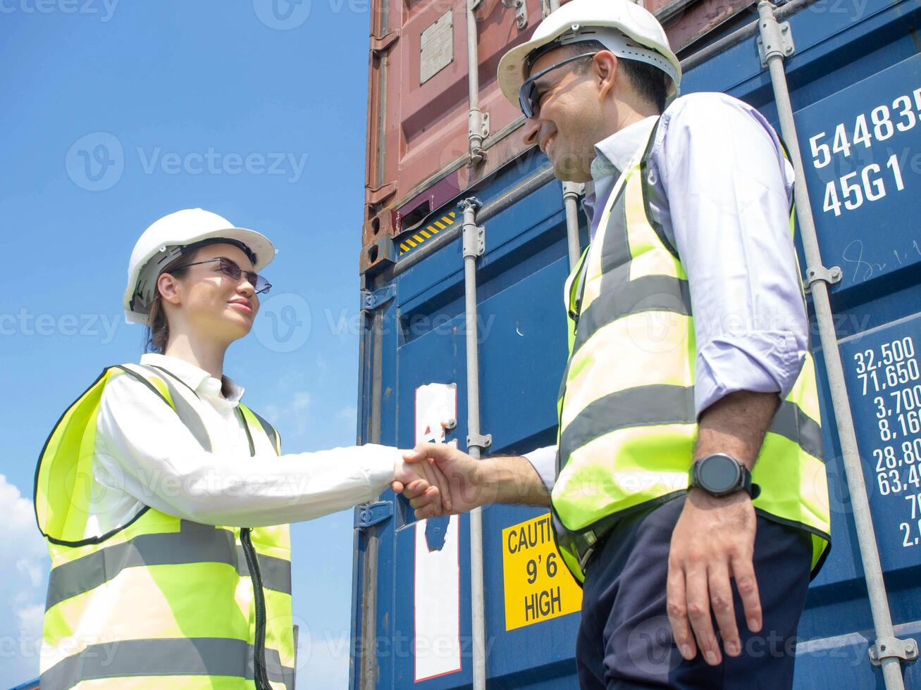 shakehand labor supervisor manager white hardhat safety happy smile helmet business financial investment customer concept success company container import export corporate economy currency profession photo