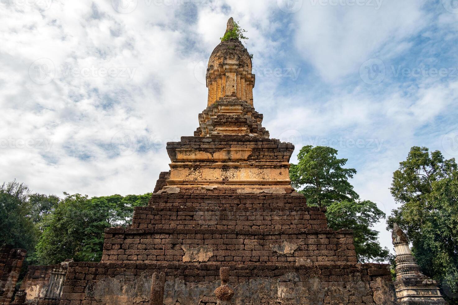 Ancient pagoda in Wat Chedi Jet Thaew the largest temple compound in Si Satchanalai Historical Park of Sukhothai province of Thailand. This temple consists of 32 chedis in various style. photo