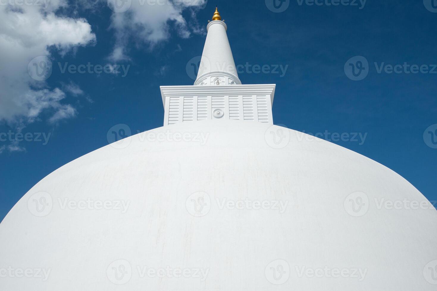 Ruwanwelisaya stupa in ancient city of Anuradhapura, Sri Lanka. Ruwanwelisaya stupa is one of the world's tallest ancient monuments and containing Buddha relics. photo