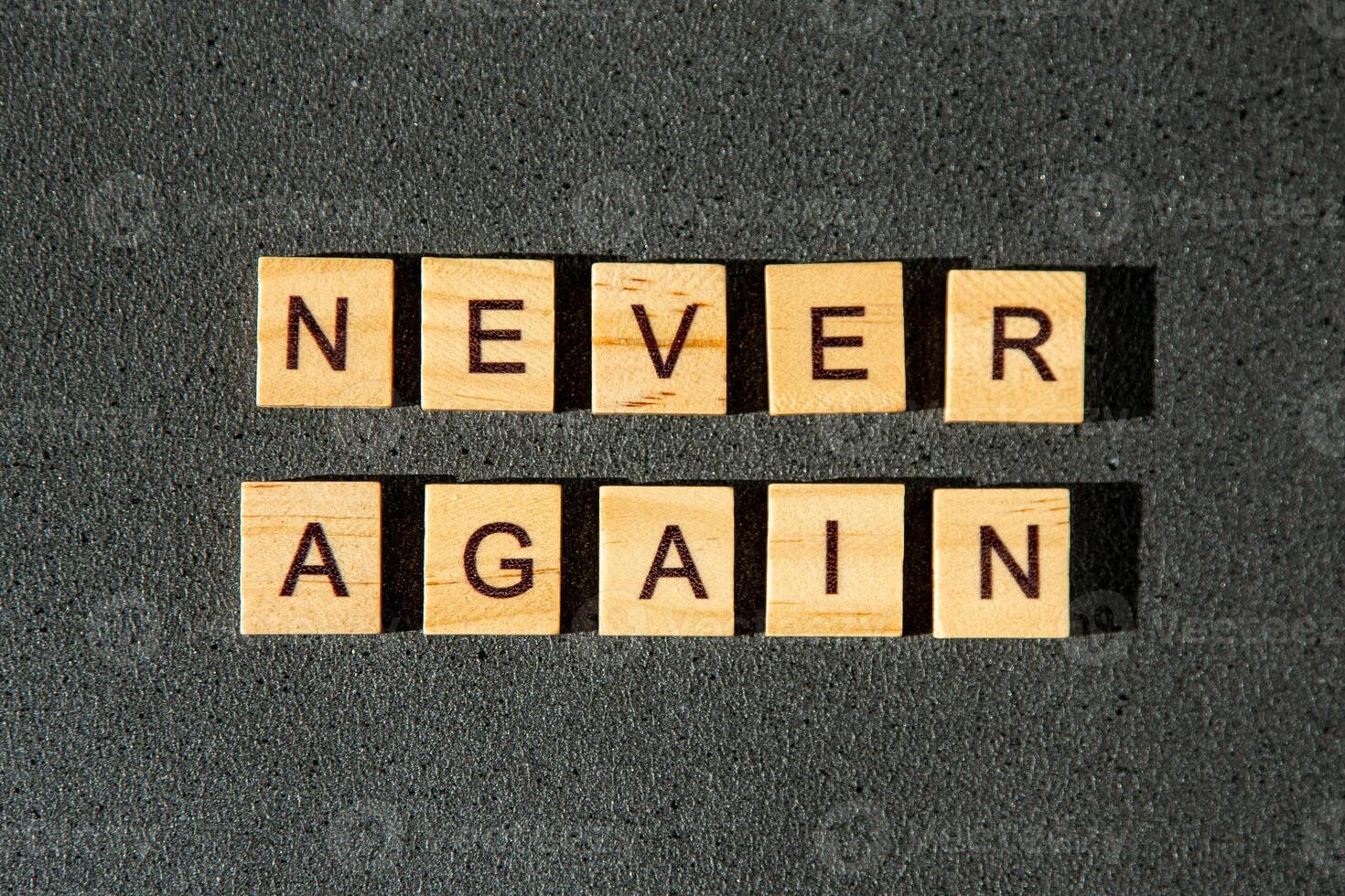 Never again wooden letters photo