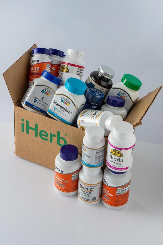 Vitamins, minerals and micronutrients from iHerb box. Lots of different jars. Biologically active food additives. Dietary supplement set buy online. Medicines for health. Kyiv Ukraine - July 13, 2023 photo