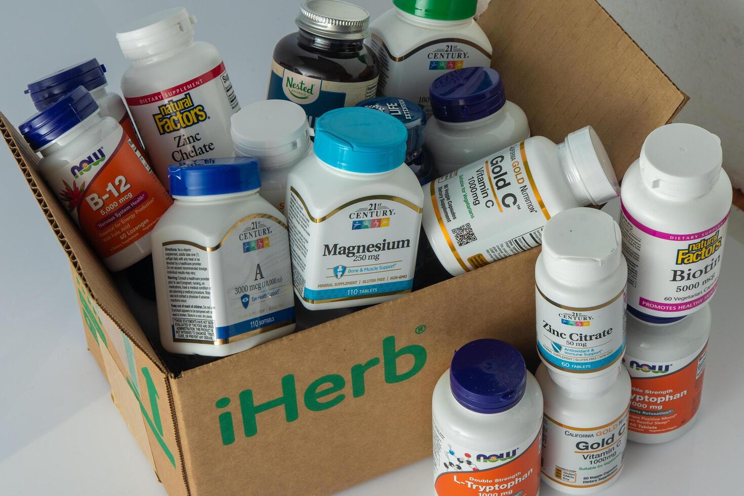 Vitamins, minerals and micronutrients from iHerb box. Lots of different jars. Biologically active food additives. Dietary supplement set buy online. Medicines for health. Kyiv Ukraine - July 13, 2023 photo