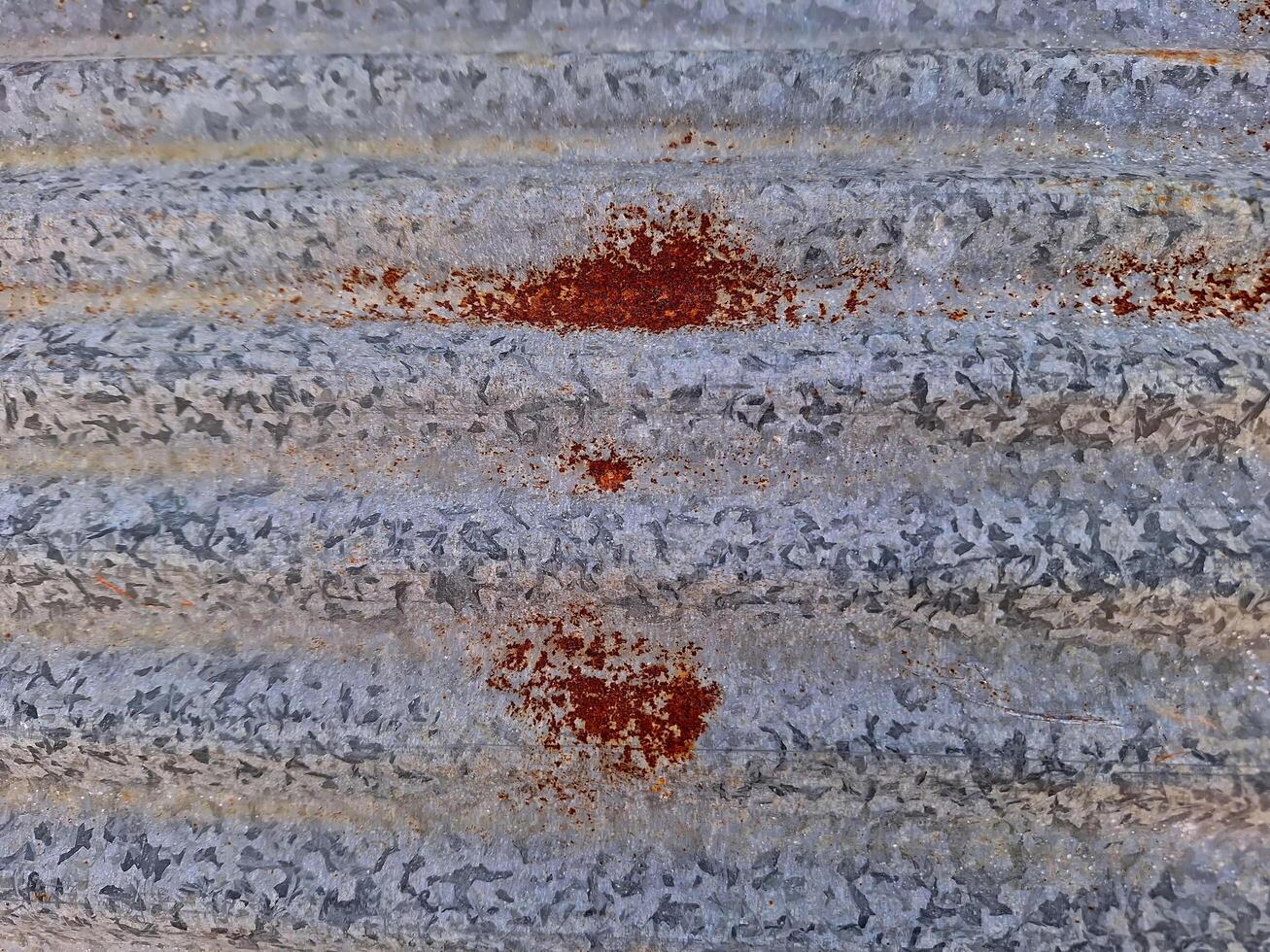 Close-up of rust on an old galvanized sheet. photo