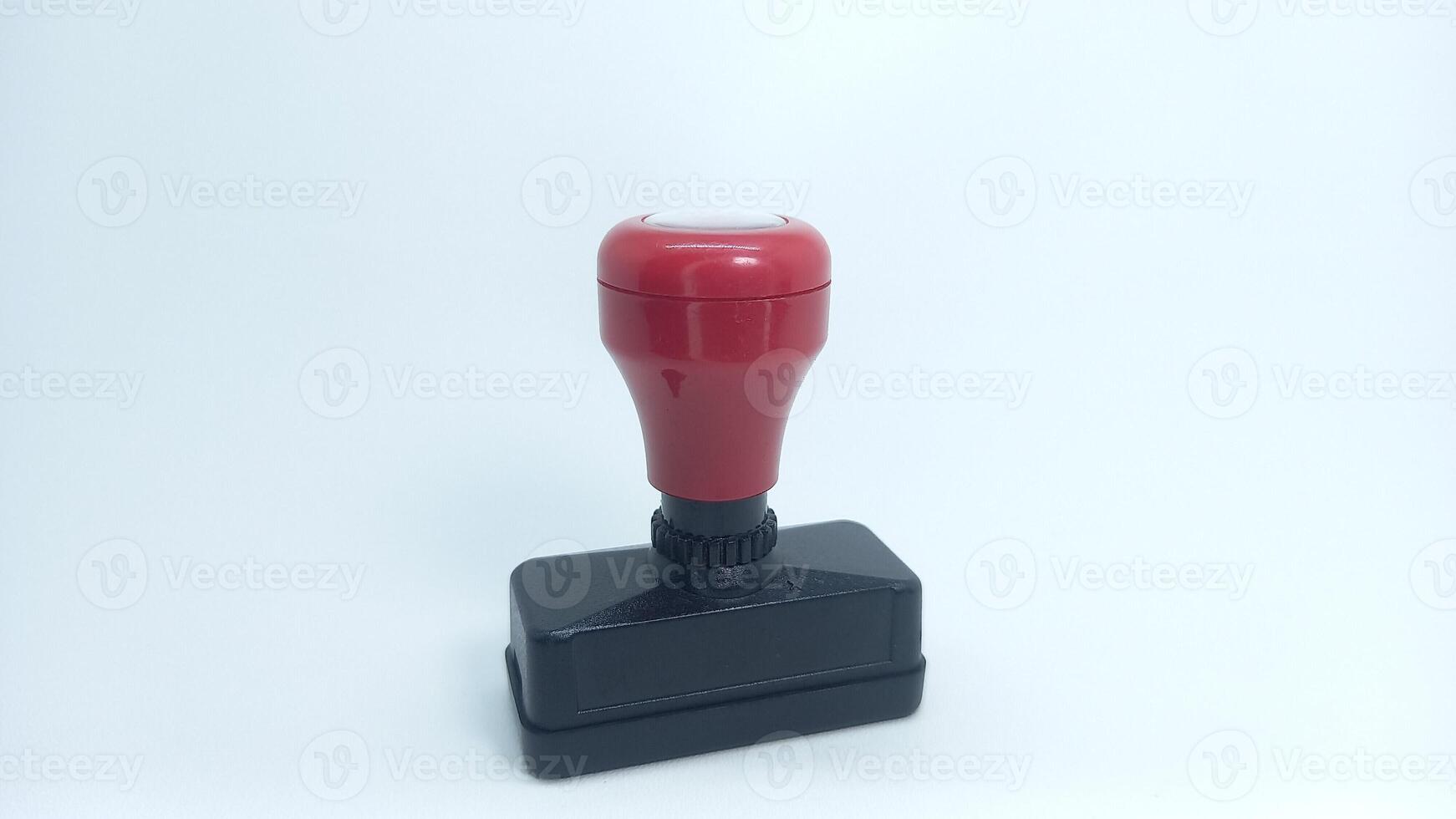 a red rubber stamp on a white background photo