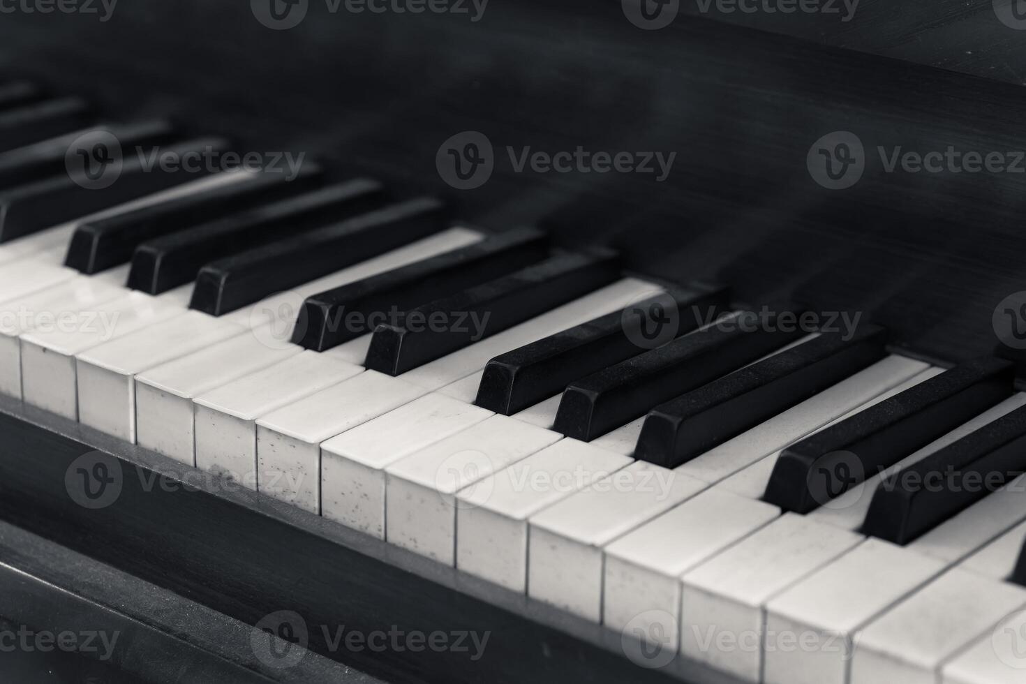 black and white photo of a piano with the keys showing