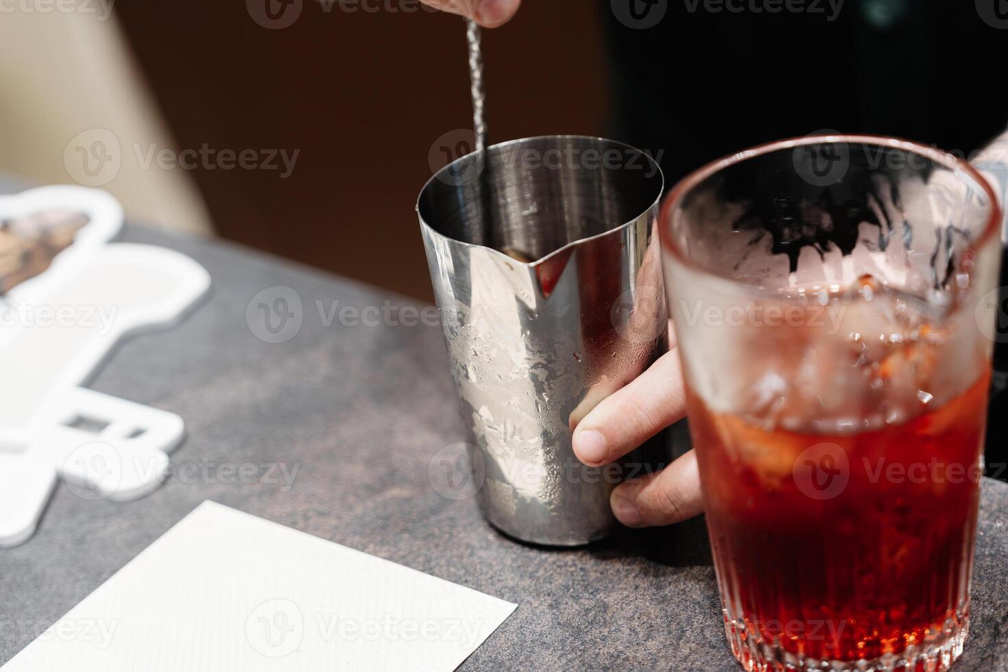 Preparation of a delicious cocktail at the bar. photo