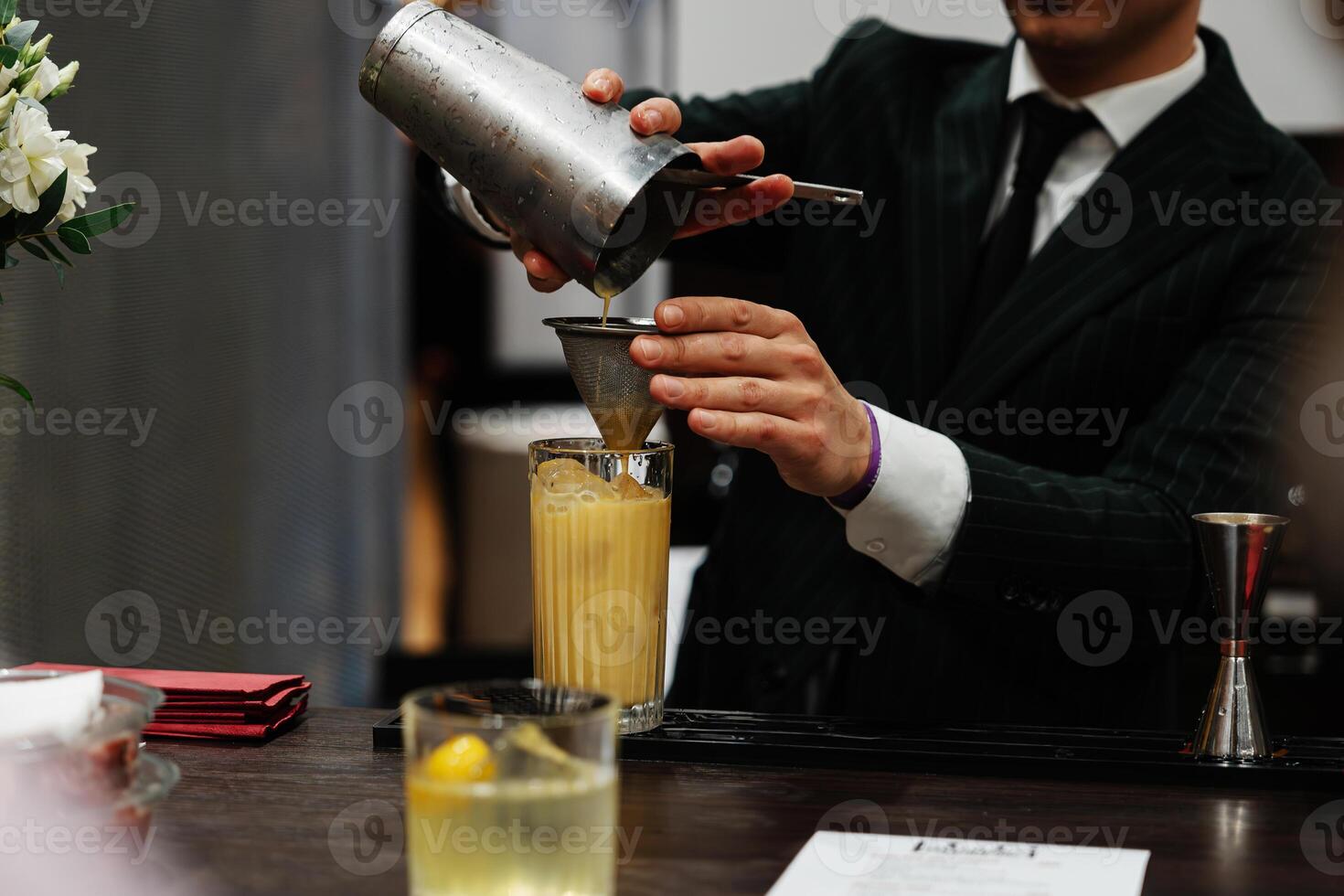 Preparation of a delicious cocktail based on juice and fruit. photo