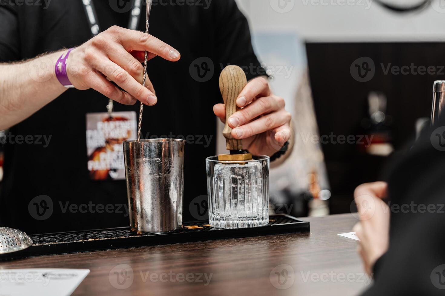 The bartender prepares cocktails for the client. photo