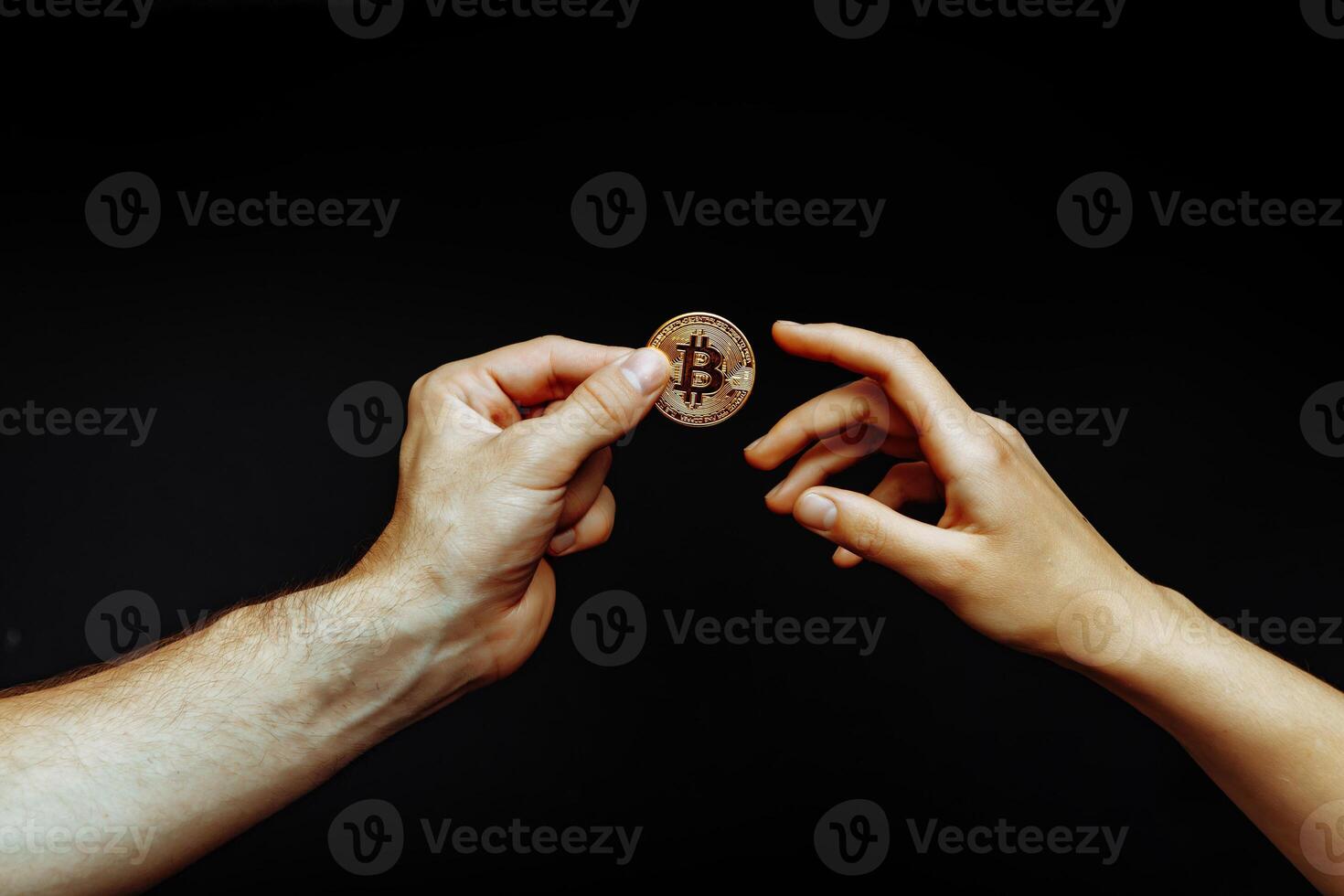 Bitcoin transfer from hand to hand photo