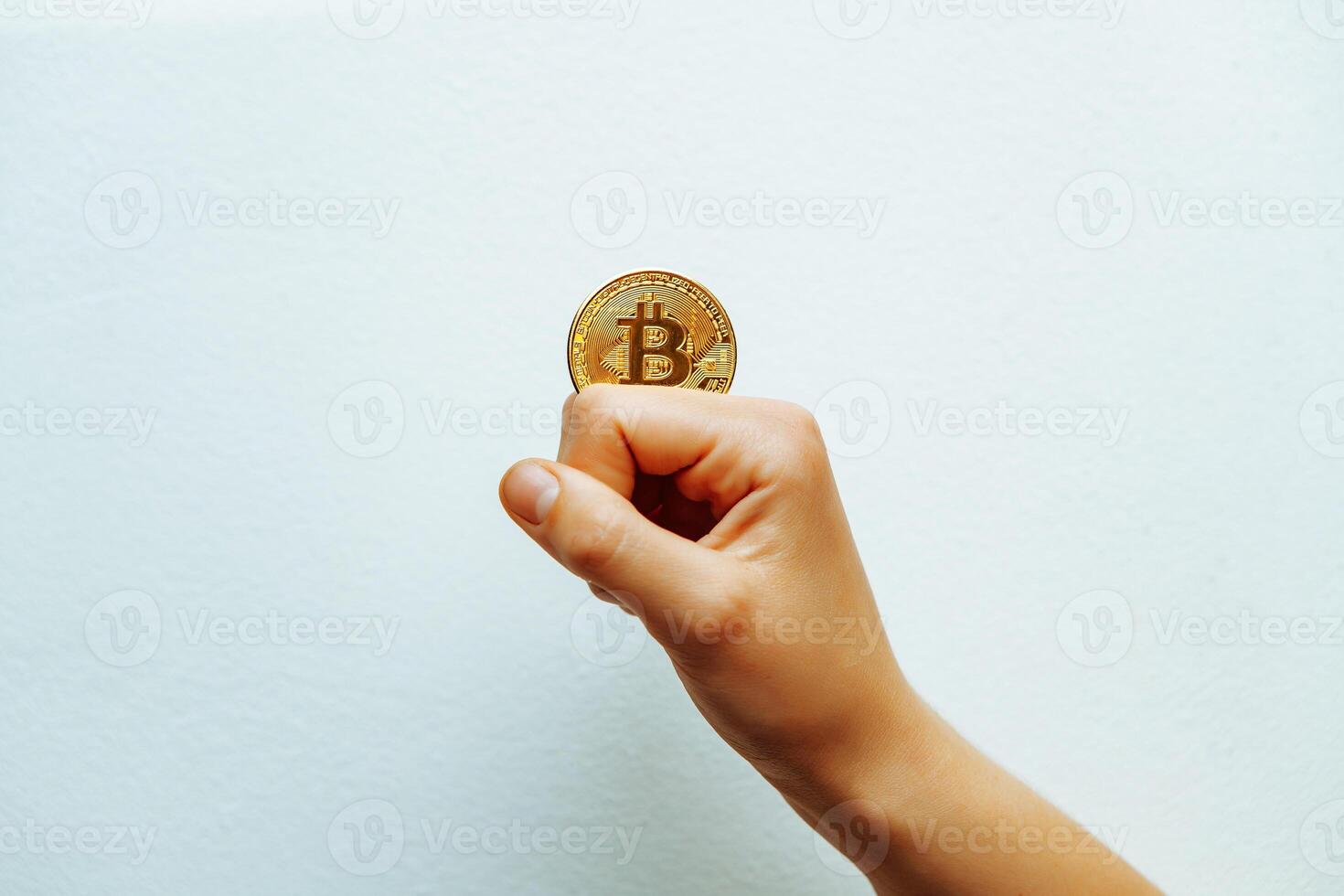 Bitcoin in hand on a white background. photo