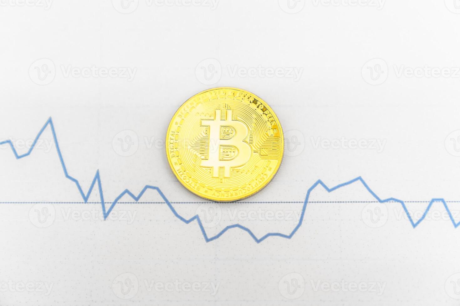 Bitcoin on white graph. New online currency. photo