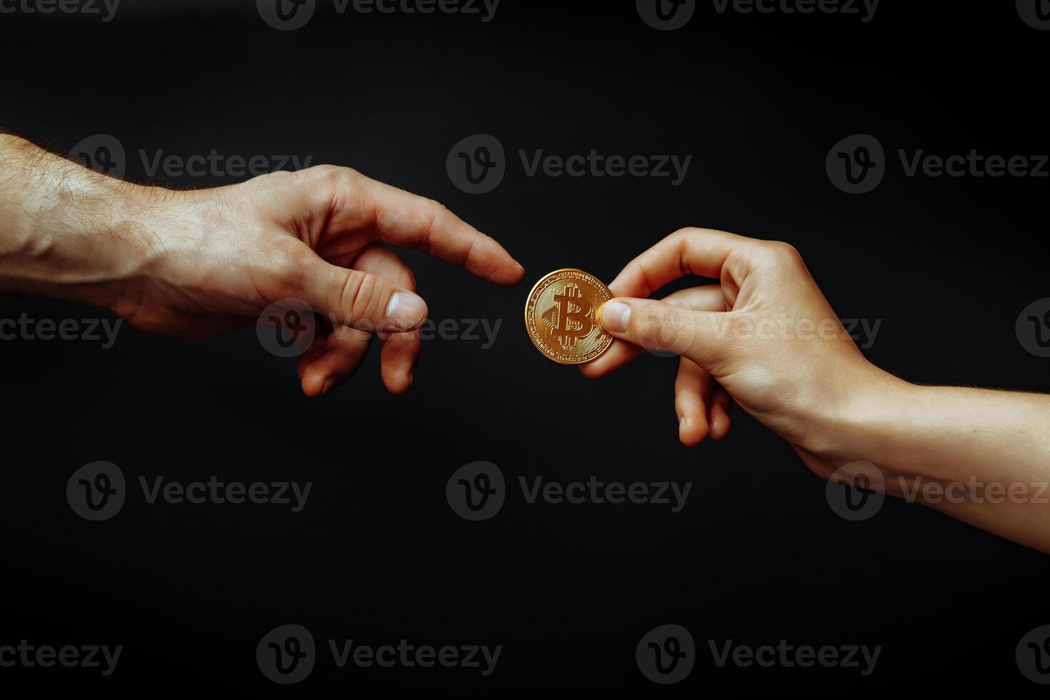 Bitcoin transfer concept from hand to hand. photo