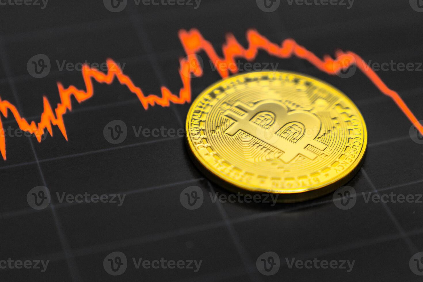 Bitcoin on the black graph. New online currency. photo
