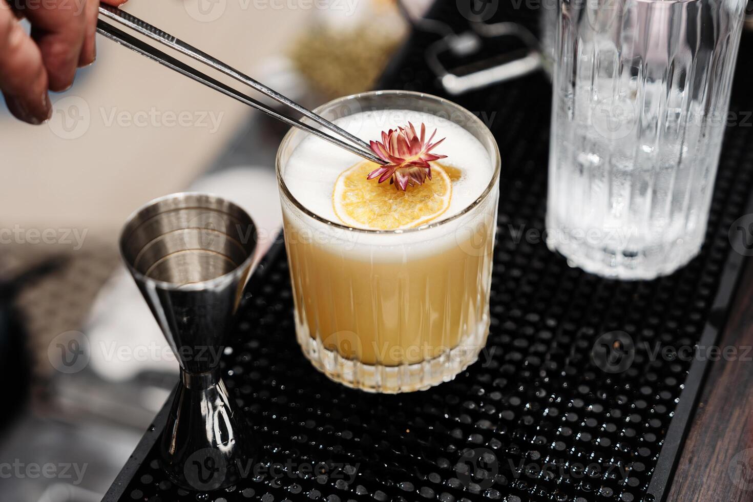 Preparation of a delicious cocktail based on juice and fruit. photo