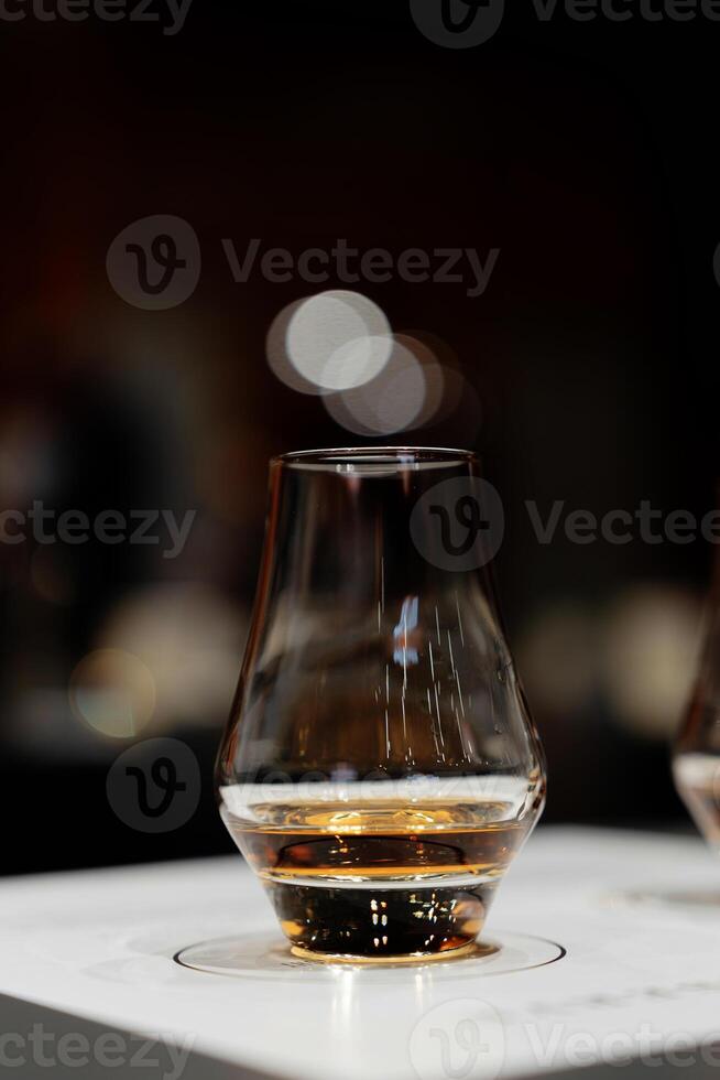 Whiskey tasting. Bright glasses with alcohol. photo