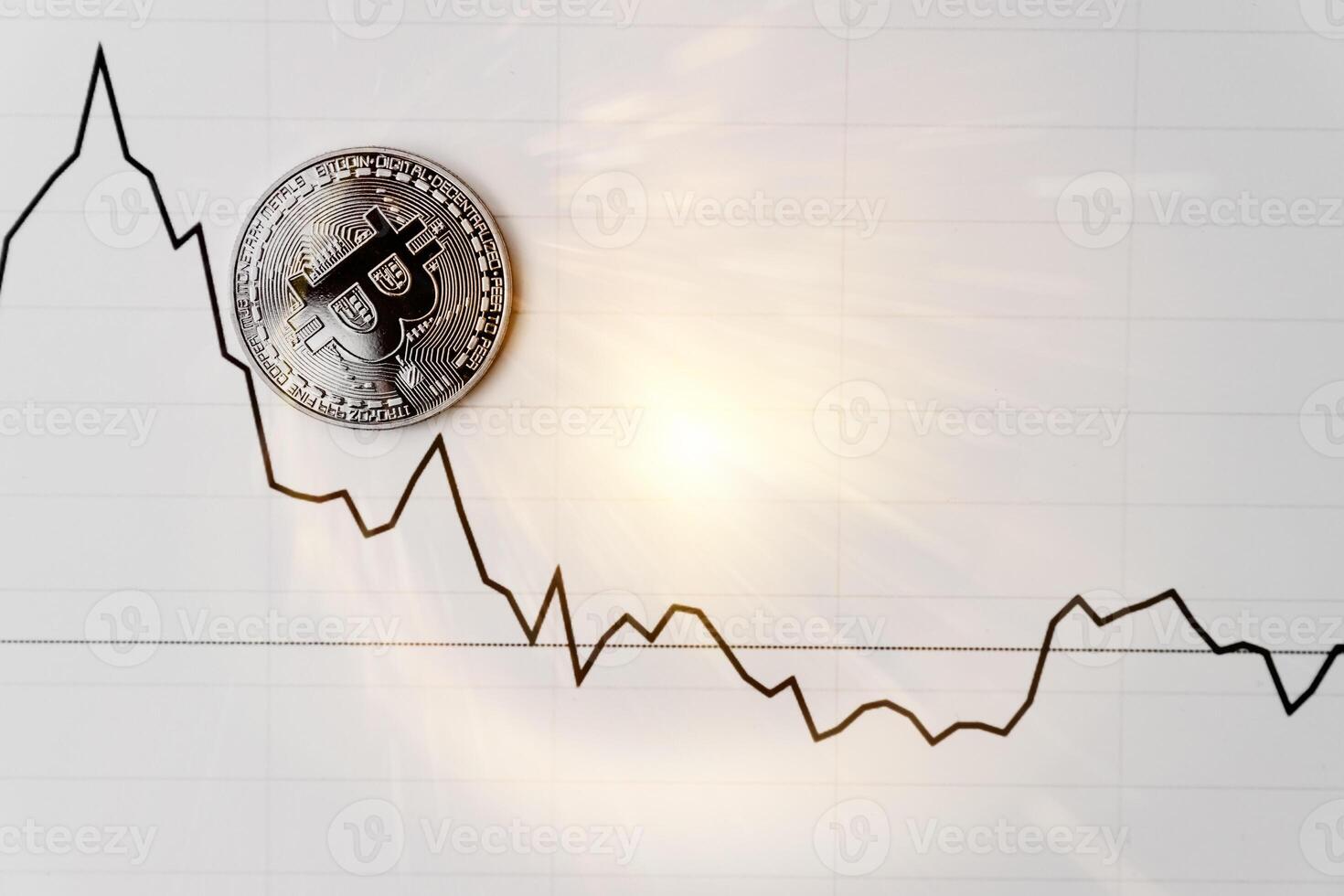 Bitcoin on white graph. New online currency. photo