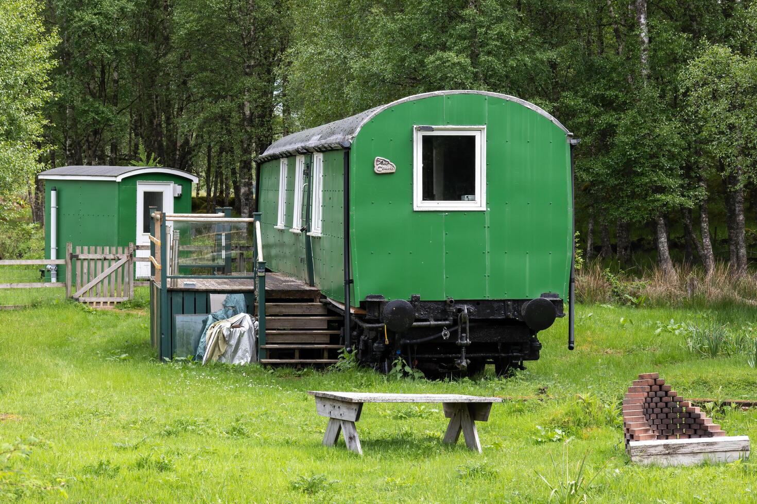 RANNOCH STATION, SCOTTISH HIGHLANDS, SCOTLAND, UK, MAY 25. Old railway carriage used as a home at Rannoch railway station in the Scottish Highlands, Scotland on May 25, 2024 photo