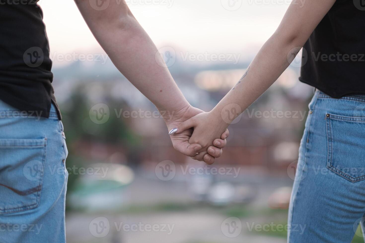 the hands of a young couple photo