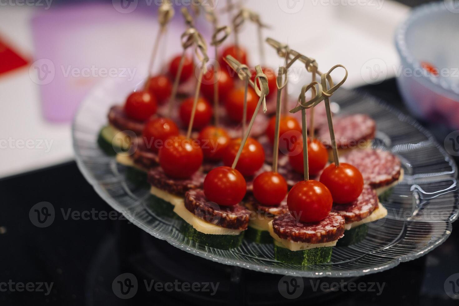 Mini Greek deli kebabs with salami, cheese, cherry tomatos and cucumber - party finger food photo