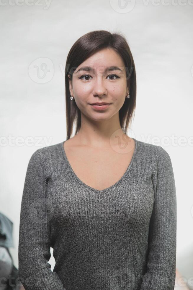 Headshot Portrait of happy girl with freckles smiling looking at camera. White background. photo