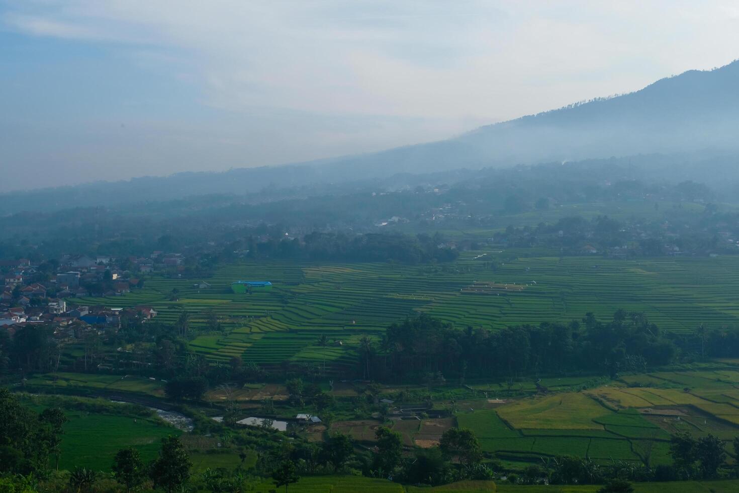 The silhouette of Mount Manglayang when the weather is foggy. Textured Background of Mountains. Graphic Resources. Industry Agricultural Photography. Panoramic landscape. Nature Photography Concept. photo