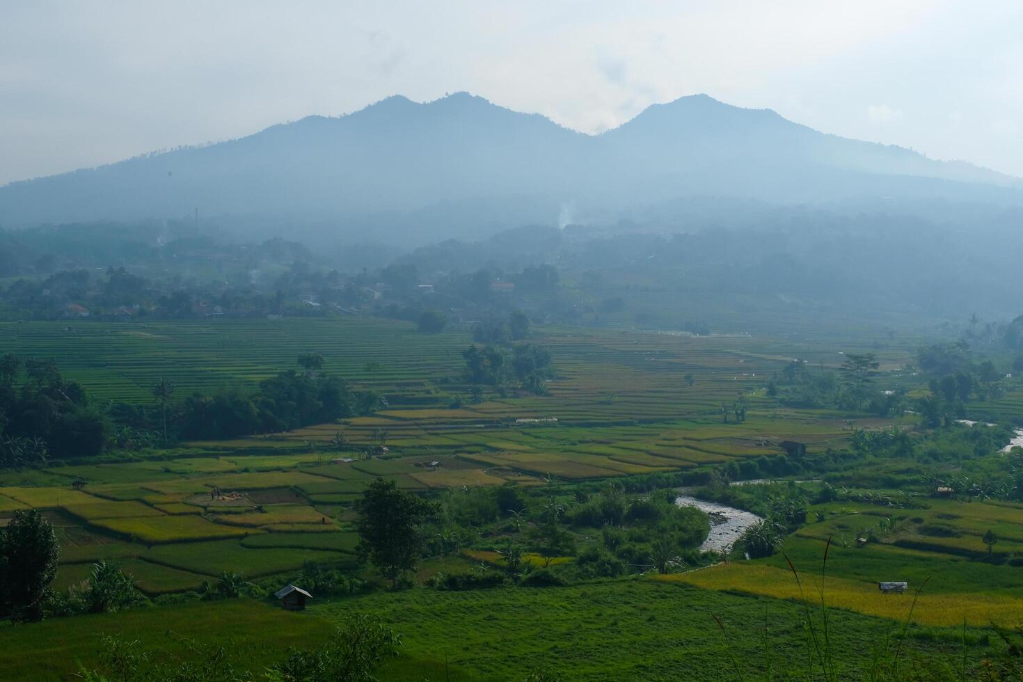 The silhouette of Mount Manglayang when the weather is foggy. Textured Background of Mountains. Graphic Resources. Industry Agricultural Photography. Panoramic landscape. Nature Photography Concept. photo