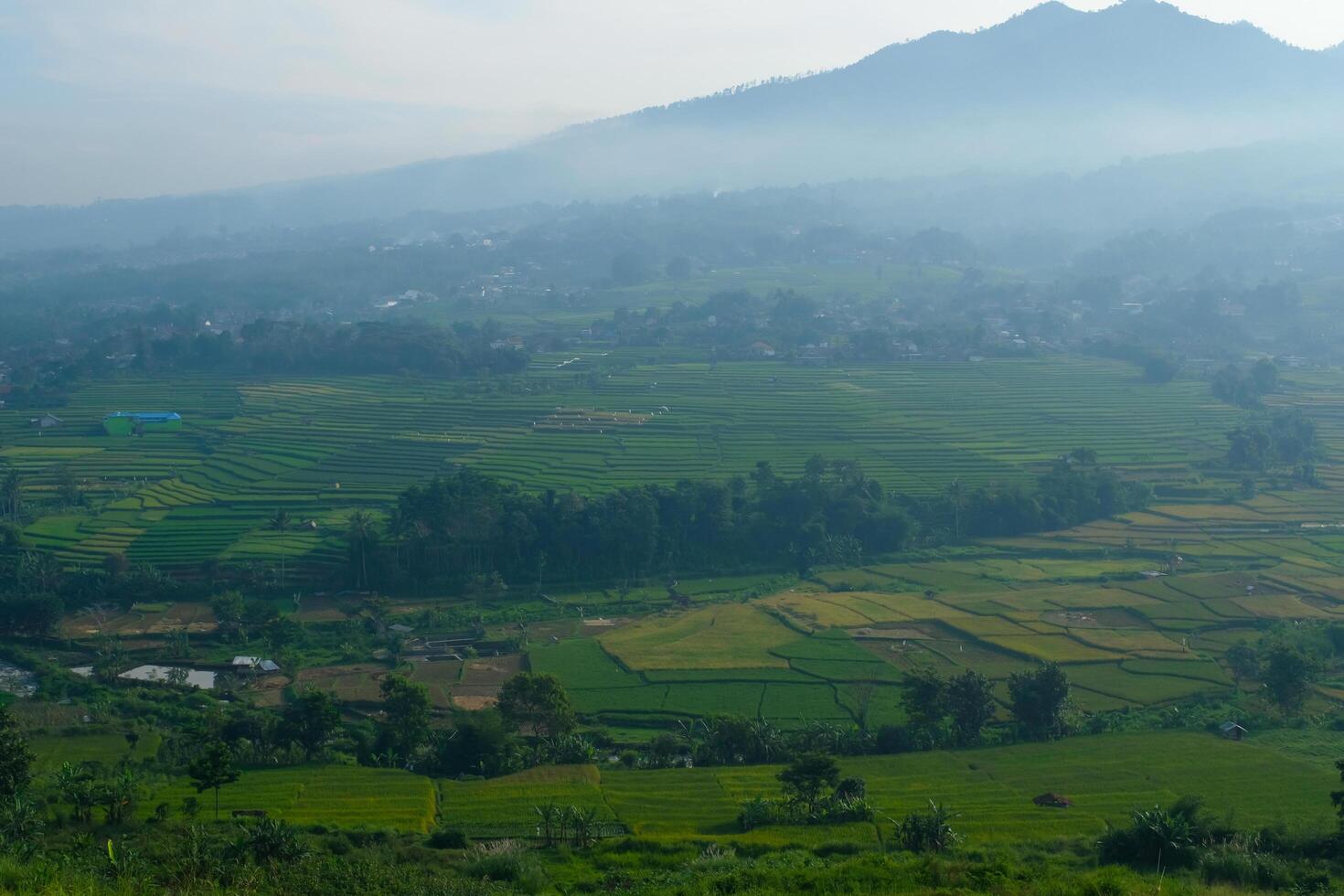 The silhouette of Mount Manglayang when the weather is foggy. Textured Background of Mountains. Graphic Resources. Industry Agricultural Photography. Panoramic landscape. Nature Photography Concept. photo