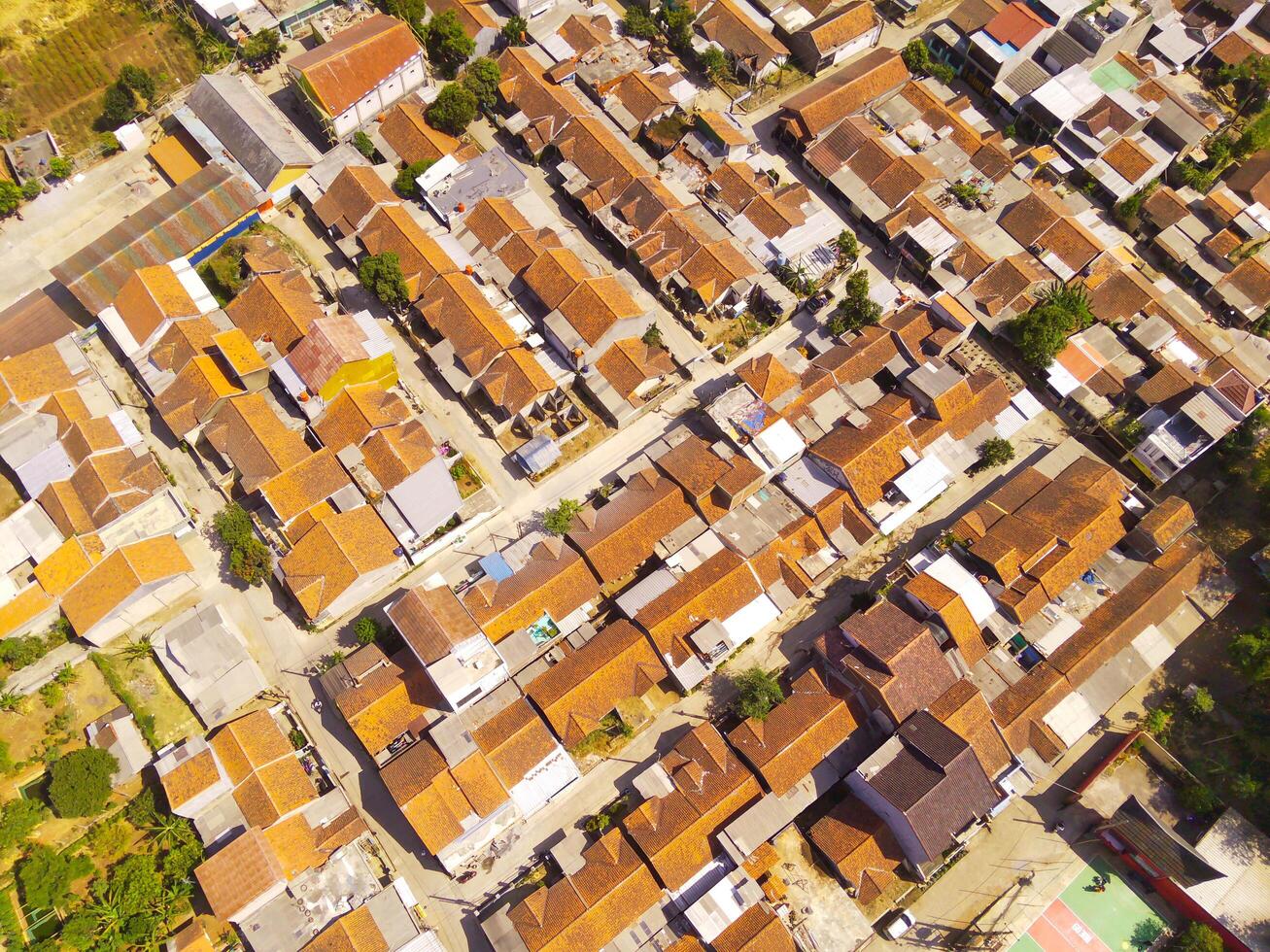 Drone Photography. Aerial Landscape Dense Residential Neighborhood at the top of Pangradinan Mount in the morning, Bandung - Indonesia. Aerial Photography photo
