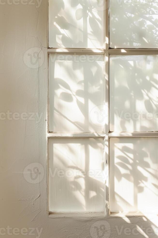 Soft Morning Light Filtering Through a Bedroom Window Casting Shadows of Leaves photo