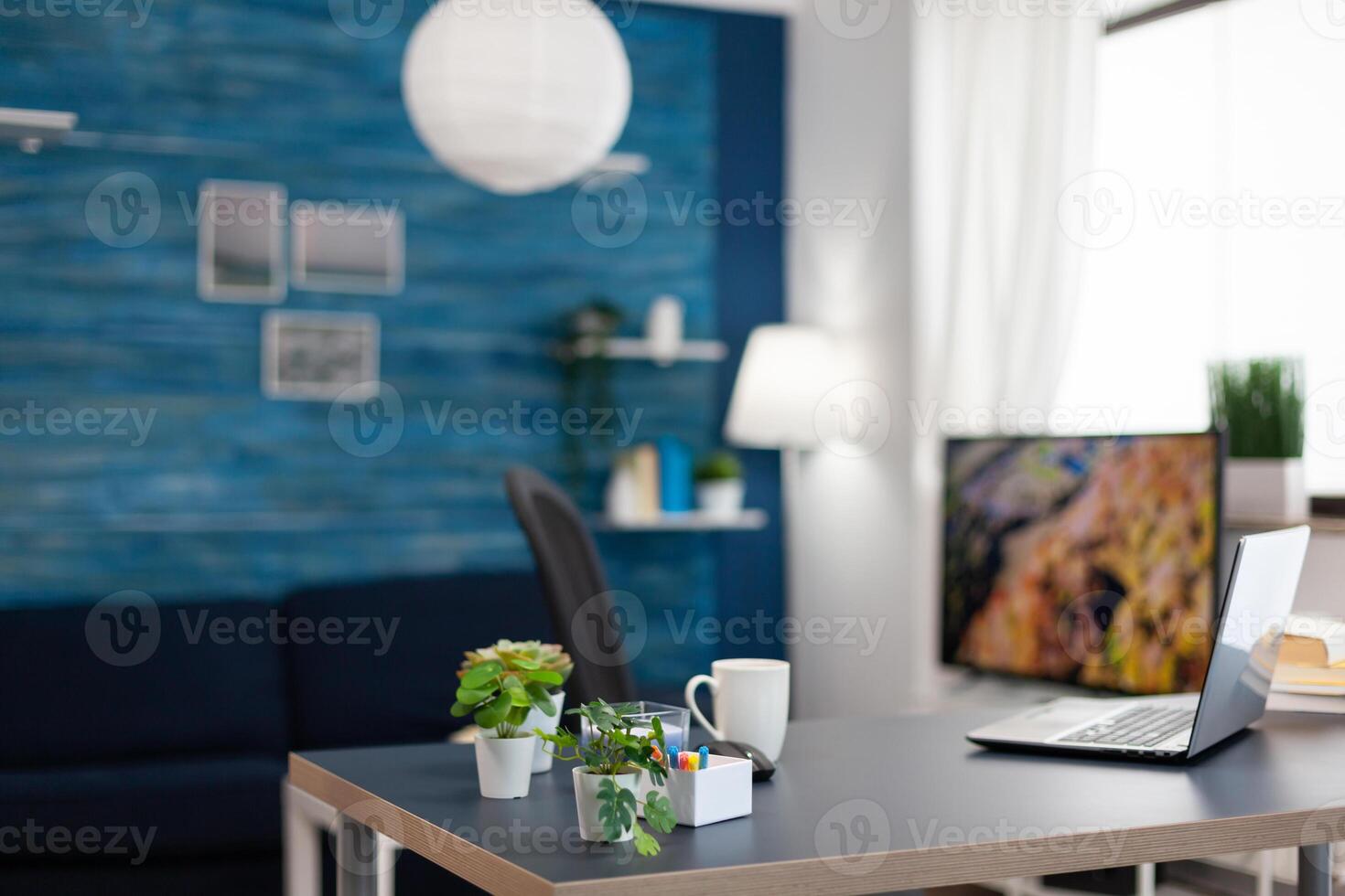 Small flowers on office desk in empty apartment. Cozy home living room with nobody in it with beautiful interior design. photo