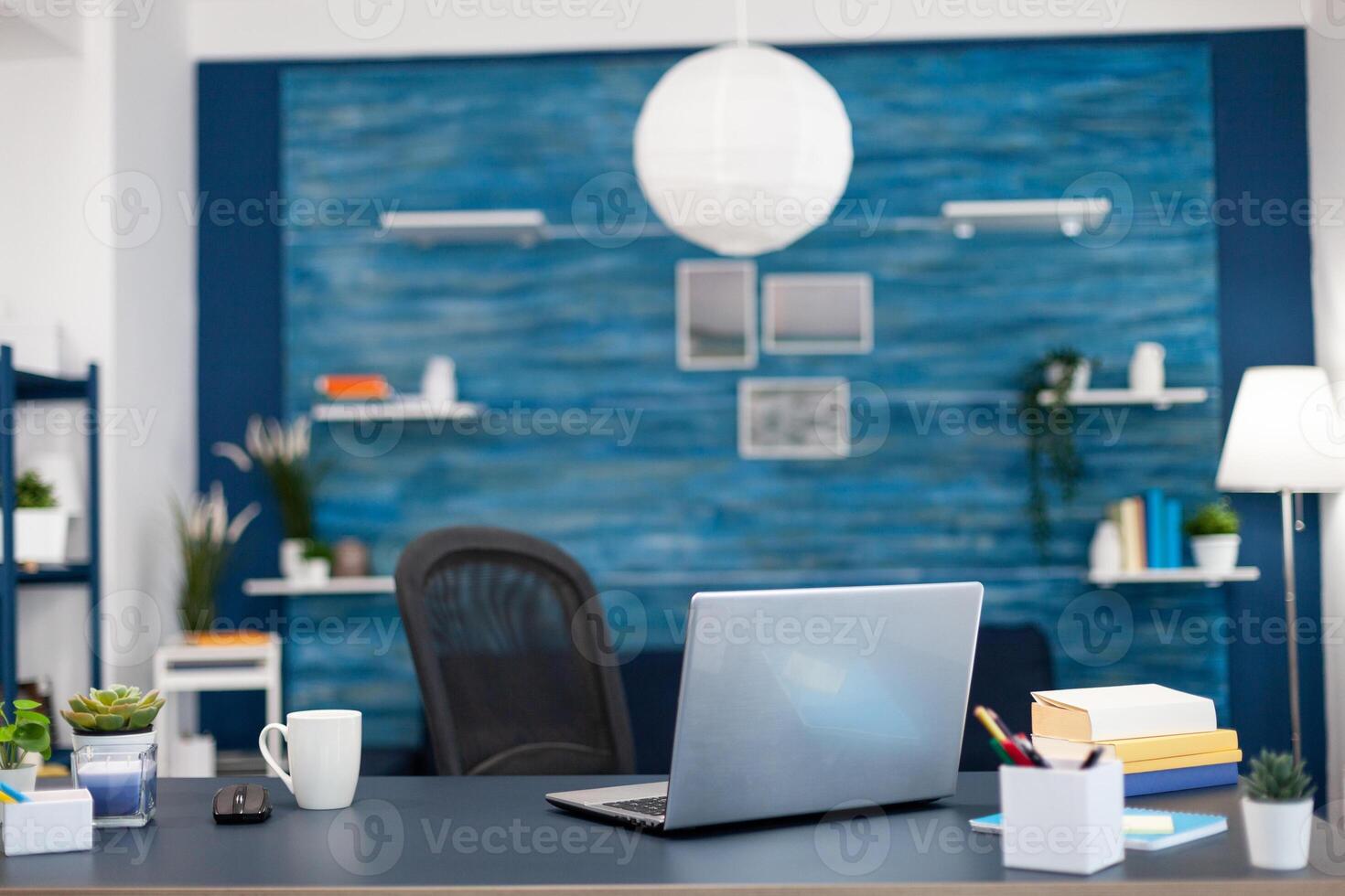 Stack of books on modern furniture in empty office. Cozy home living room with nobody in it with beautiful interior design. photo