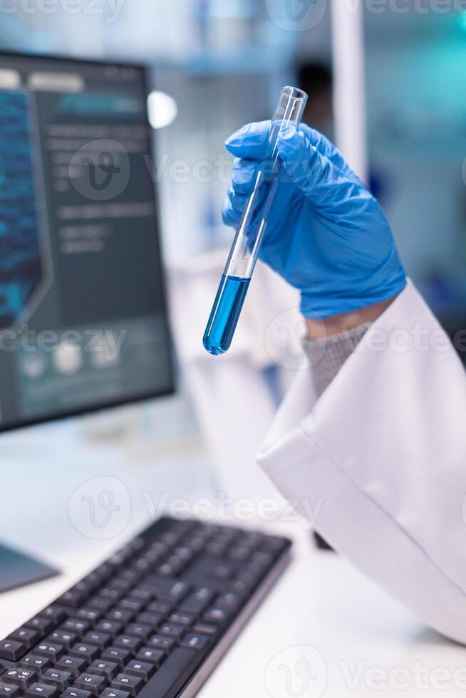 Closeup of test tubes for science experiment. Research of medical scientist chemist doctor discovery scientific disease with professional equipment in modern laboratory photo
