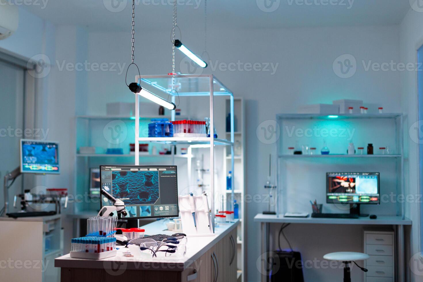 Modern laboratory for scientific research with professional equipment for studying virus. Modern lab with nobody in it ready for vaccine development against covid19 pandemic. photo