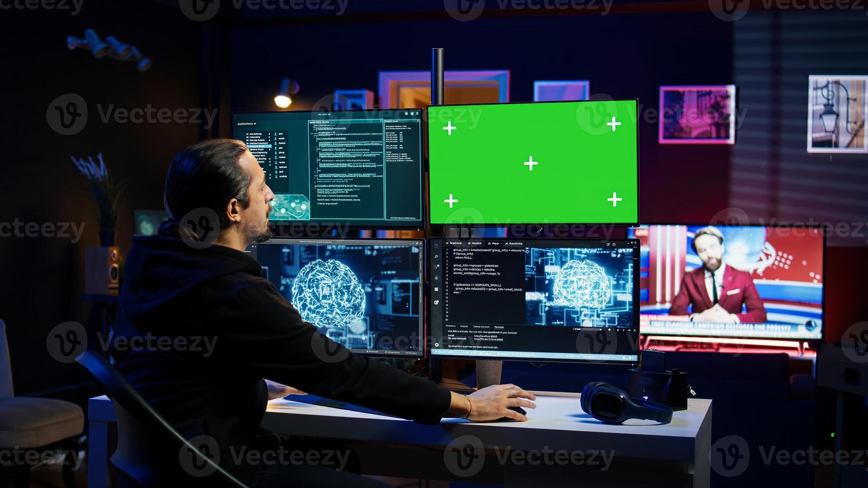 Hacker using green screen monitor and artificial intelligence to write spyware software gathering data from users. Scammer in apartment using AI and mockup PC display to do fraud using AI, camera B photo