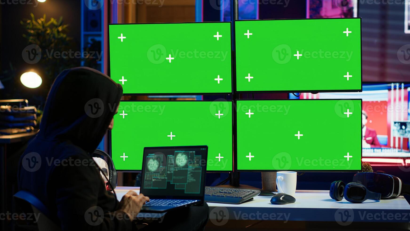Man writing code on laptop in front of isolated screen PC monitors, trying to get past security systems. Hacker using chroma key computer and notebook to make scripts that can hack devices, camera A photo