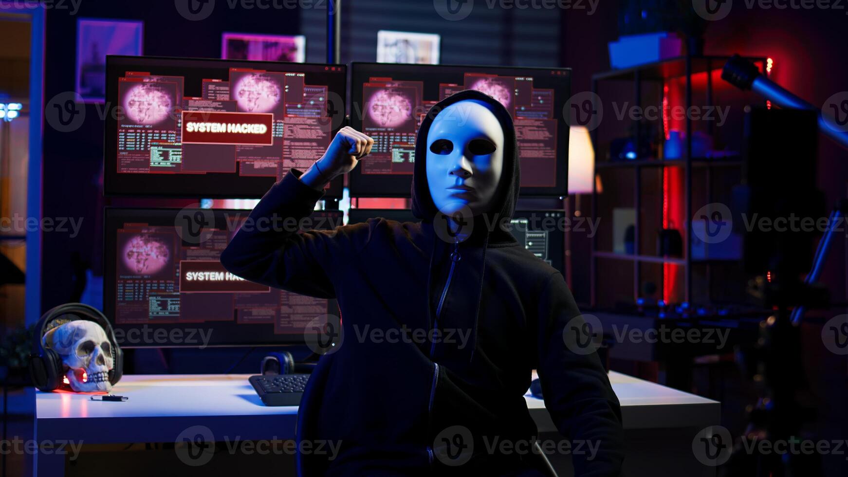Dissident social justice crusader doing online activism, wearing anonymous masks and filming in underground bunker, blackmailing government after stealing secret military documents, camera B photo