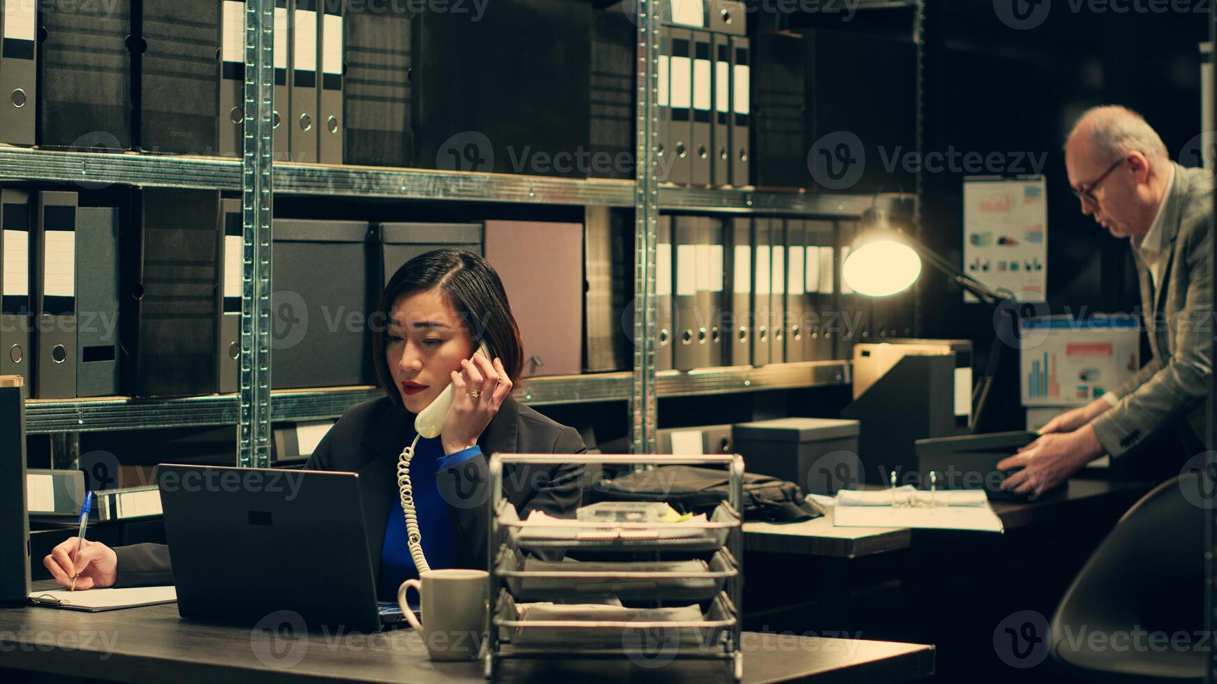Agent communicates with detectives or law enforcement personnel to discuss findings and share updates to help with ongoing investigation. Officer asks for forensics on landline phone call. Camera A. photo