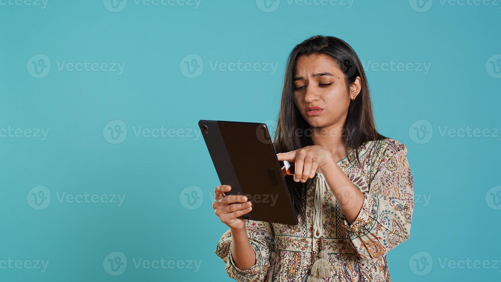 Woman trying to do purchases, frustrated with error received while adding payment method on website, studio background. Upset person unable to do internet shopping, getting card rejected, camera A photo