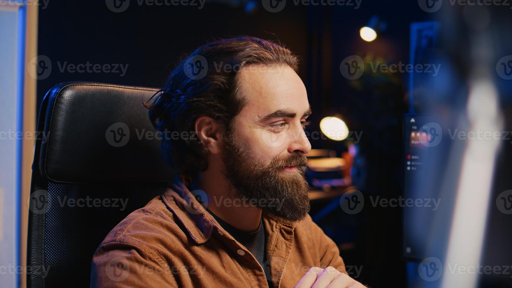 Happy software engineer feeling satisfied after removing all bugs while coding on computer, close up. Joyous IT admin looking at PC screen, pleased after solving script errors, camera B close up photo