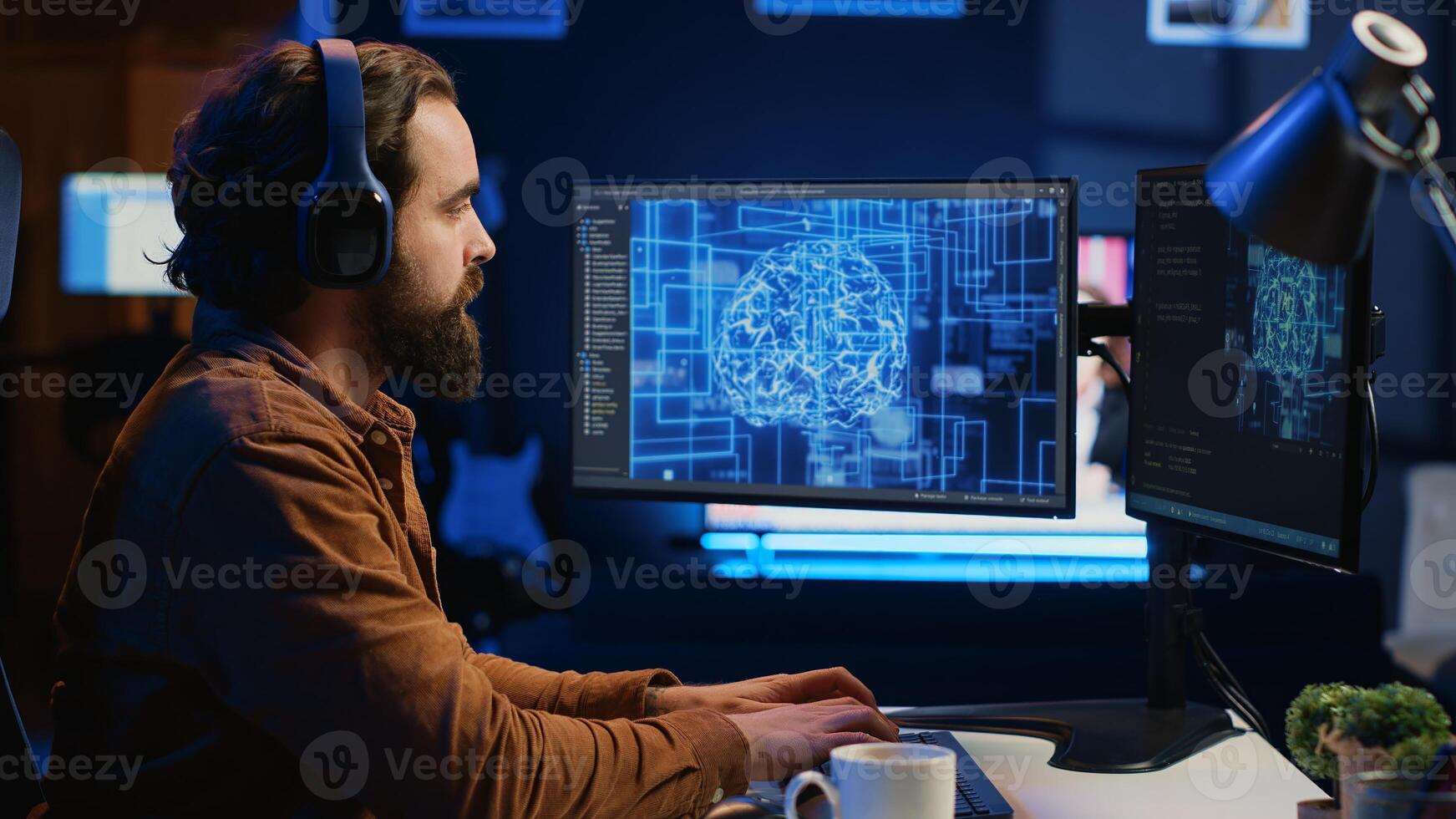 Developer updating artificial intelligence neural networks, drinking coffee and listening music in personal office. IT expert enjoying hot beverage and audio podcasts while writing AI code, camera A photo