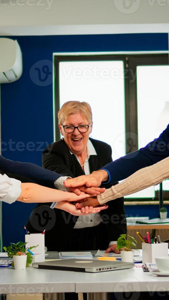 Happy diverse colleagues with new business opportunity enjoing victory. Overjoyed multiethnic company team throwing up hands celebrating successful project, receving good news. photo