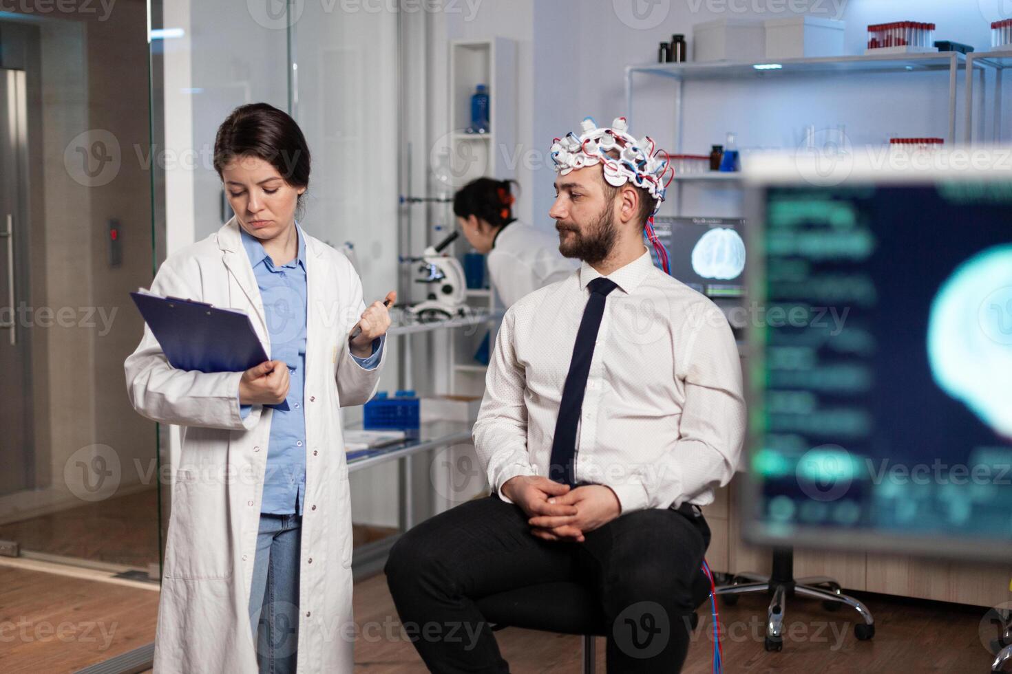 Specialist neurologist researcher monitoring brain evolution developing treatment for neurological disease in modern laboratory. Scientist doctor analyzing nervous system activity. Neurology service photo