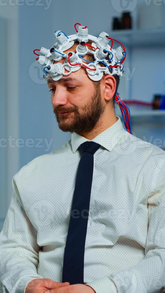 Expert research doctor in neuroscience developing treatment for neurological diseases discussing patient evolution using tablet. Doctor researcher analyzing brain functions and health status photo