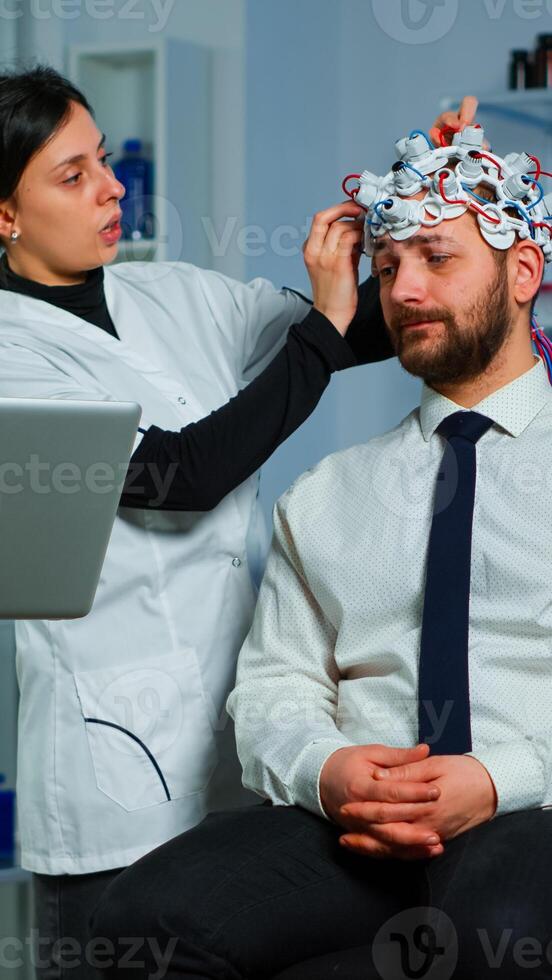 Women team neurological researchers working together developing treatment for diagnosis of braindisease, explaning eeg results, health status, brain functions, nervous system and tomography scan photo
