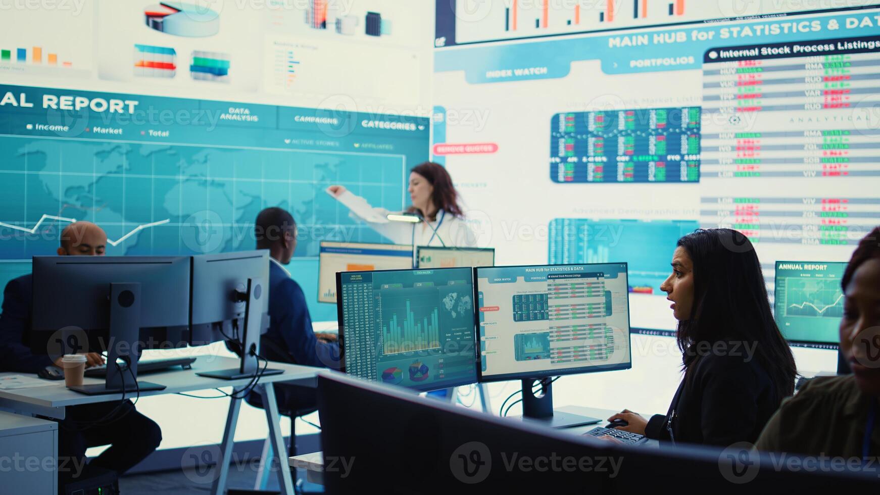 Indian company analyst reviews feedback on sales and orders to work on future improvements, working with statistics on a big screen. Developing marketing and PR strategies. Camera B. photo