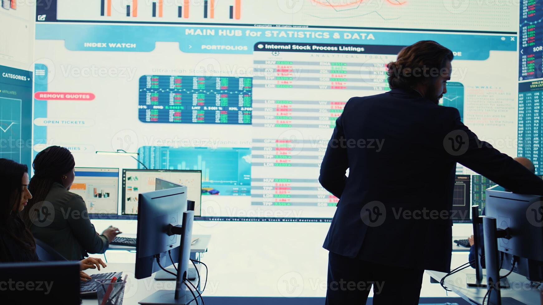 General director CEO sharing insight about a new development strategy with his employees, showing important data reports to analyze organizational activity status in a control room. Camera B. photo